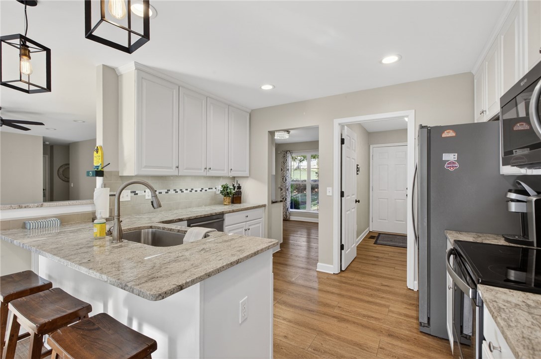 322 Shorecrest Drive Seneca, SC 29672 - Photo 10 of 30 This bright kitchen features ample counter space and modern appliances, perfect for everyday living.
