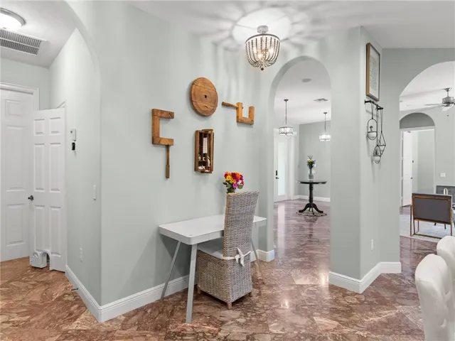 a view of dining room and kitchen with furniture