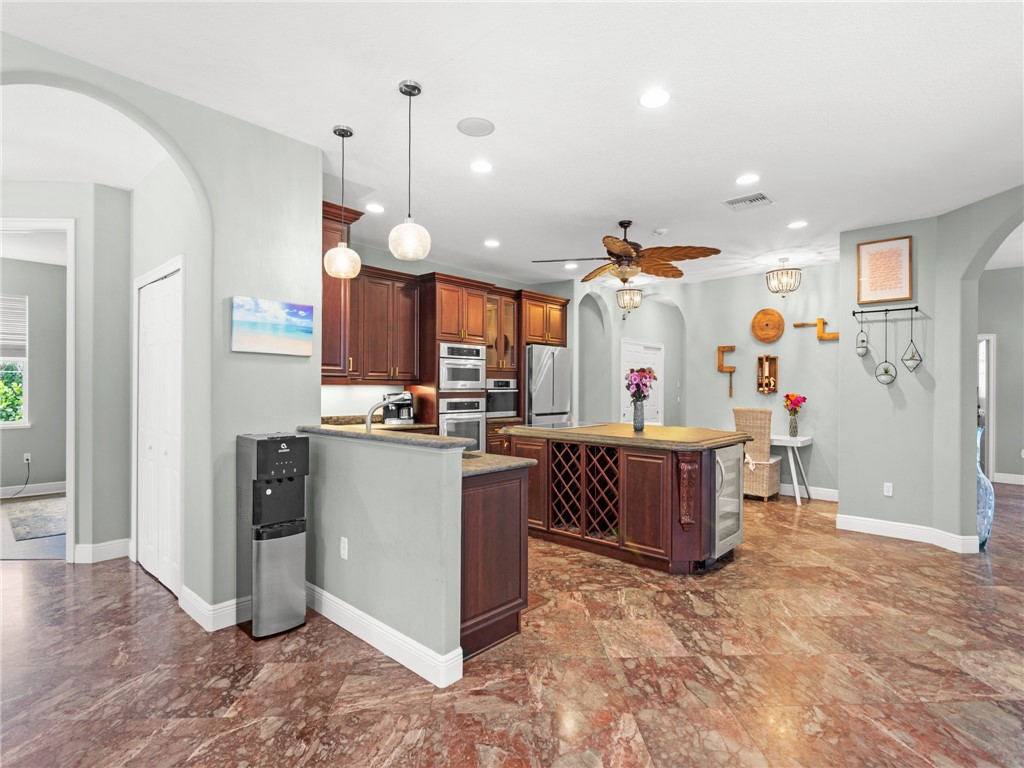 4676 Pebble Bay South, Unit BAY Vero Beach, FL 32963 - Photo 15 of 36 a kitchen view of counter top space and appliances