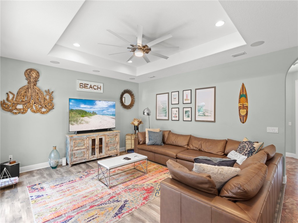 4676 Pebble Bay South, Unit BAY Vero Beach, FL 32963 - Photo 16 of 36 a bedroom with a bed and wooden floor