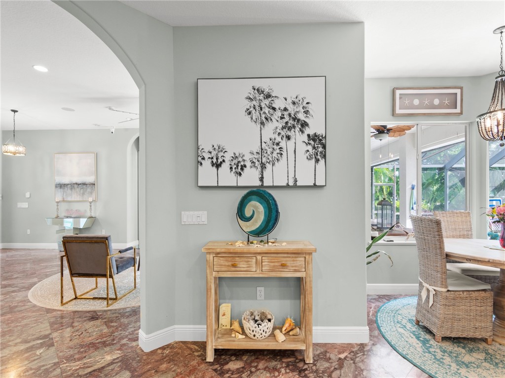 4676 Pebble Bay South, Unit BAY Vero Beach, FL 32963 - Photo 19 of 36 a living room with furniture and a window