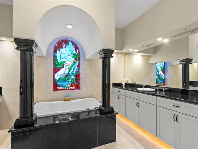 a kitchen with stainless steel appliances granite countertop a stove and a sink