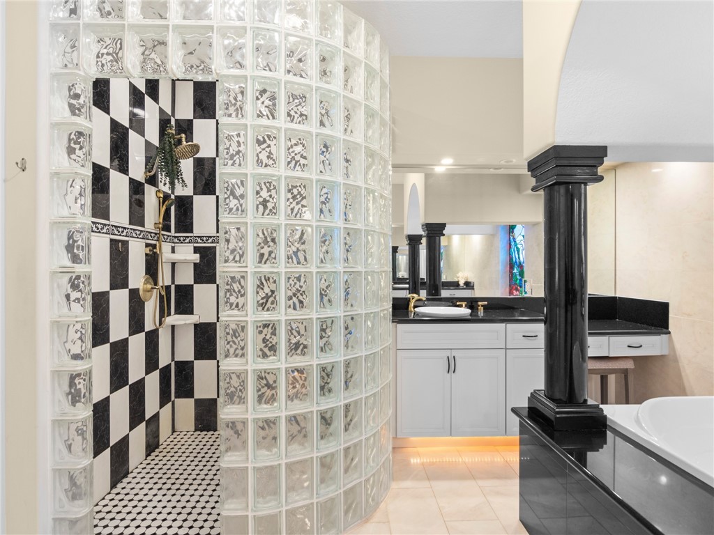 4676 Pebble Bay South, Unit BAY Vero Beach, FL 32963 - Photo 23 of 36 a kitchen with a sink and a refrigerator