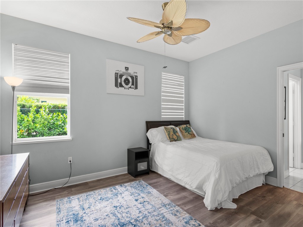 4676 Pebble Bay South, Unit BAY Vero Beach, FL 32963 - Photo 26 of 36 a bedroom with a bed and a window