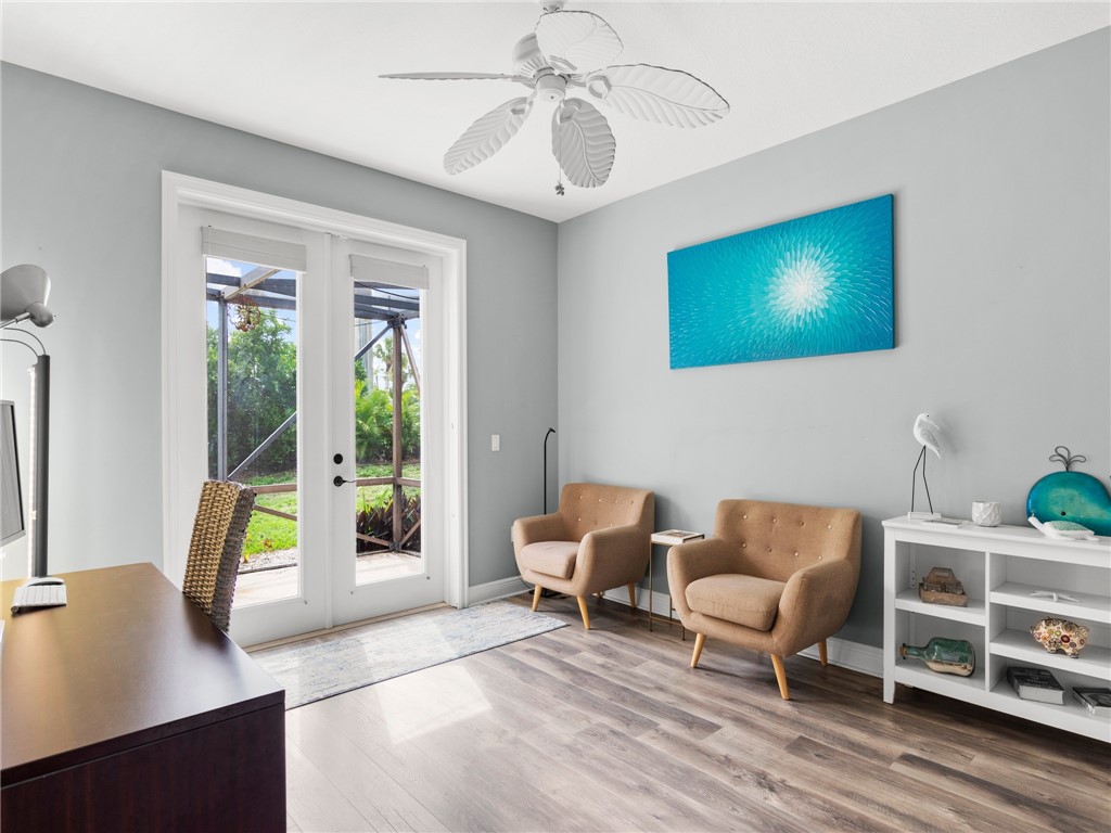 4676 Pebble Bay South, Unit BAY Vero Beach, FL 32963 - Photo 27 of 36 a living room with furniture and a flat screen tv