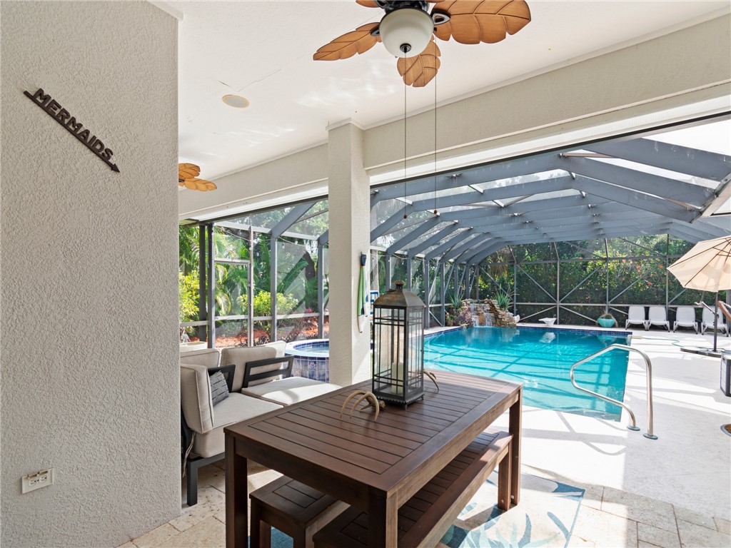 4676 Pebble Bay South, Unit BAY Vero Beach, FL 32963 - Photo 32 of 36 a view of a dining room with furniture window and outside view