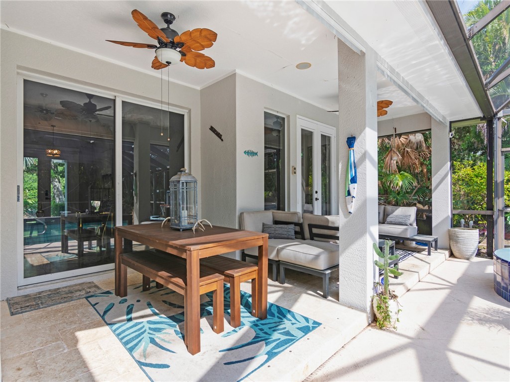 4676 Pebble Bay South, Unit BAY Vero Beach, FL 32963 - Photo 33 of 36 a outdoor space with patio the couches and a dining table with the view of the balcony