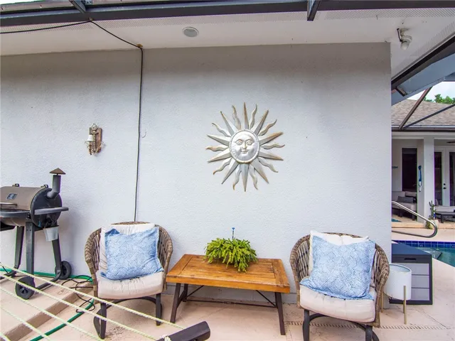 a living room with furniture and a chair