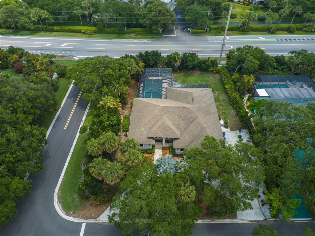 4676 Pebble Bay South, Unit BAY Vero Beach, FL 32963 - Photo 36 of 36 an aerial view of a house with a yard and lake view