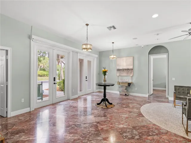a view of a livingroom with furniture and windows