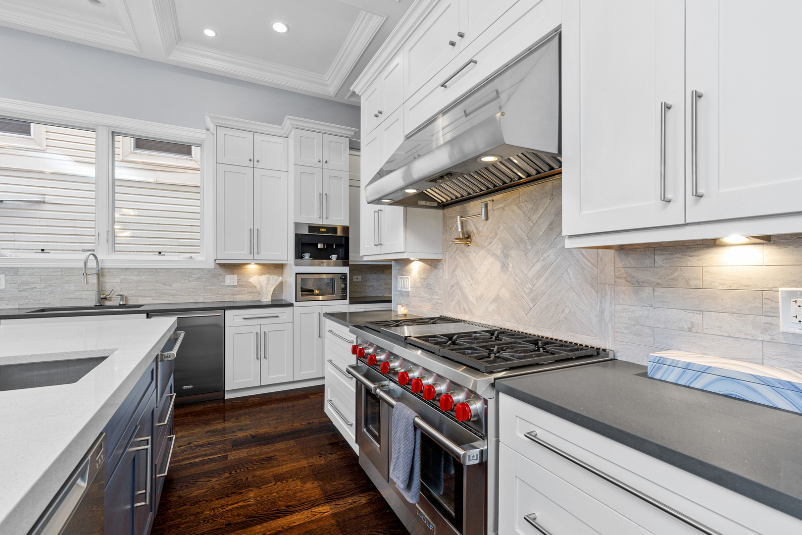 Undisclosed Address Chicago, IL 60657 - Photo 13 of 52 a kitchen with stainless steel appliances granite countertop a sink stove and cabinets