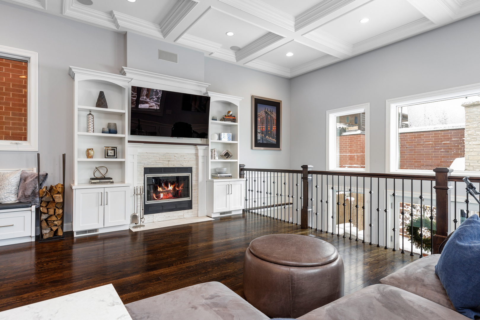 Undisclosed Address Chicago, IL 60657 - Photo 20 of 52 a living room with furniture a flat screen tv and a fireplace