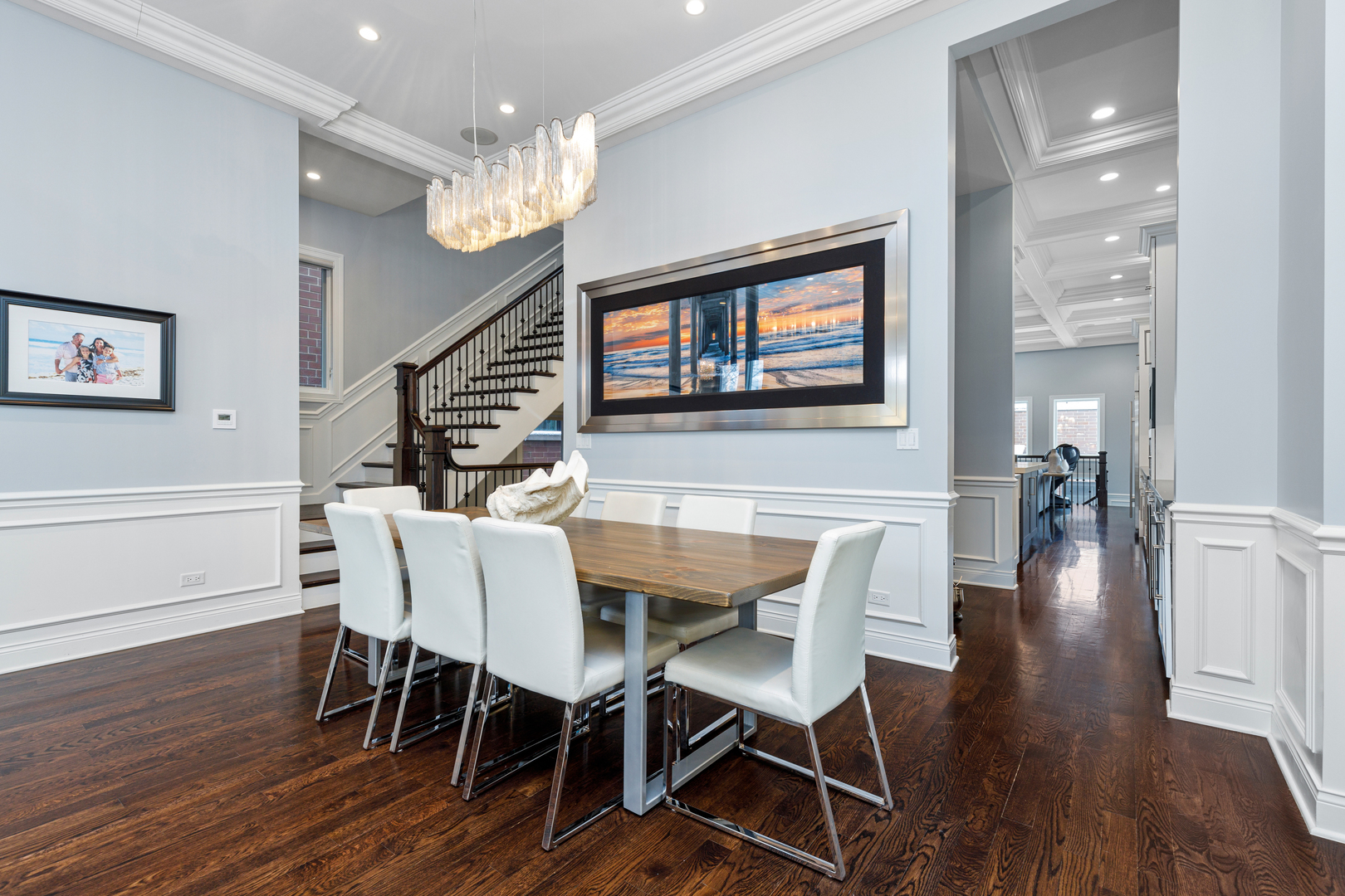 Undisclosed Address Chicago, IL 60657 - Photo 22 of 52 a dining room with wooden floor a chandelier a wooden table and chairs