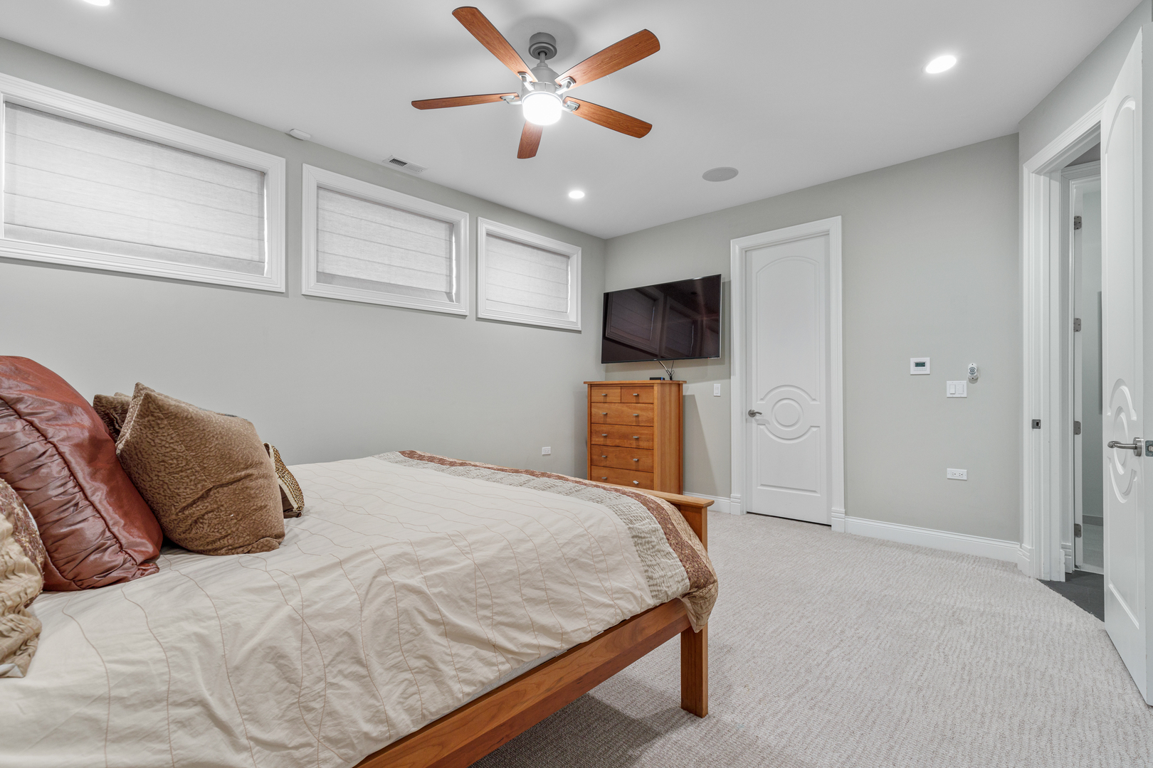 Undisclosed Address Chicago, IL 60657 - Photo 29 of 52 a bedroom with a bed and a flat screen tv