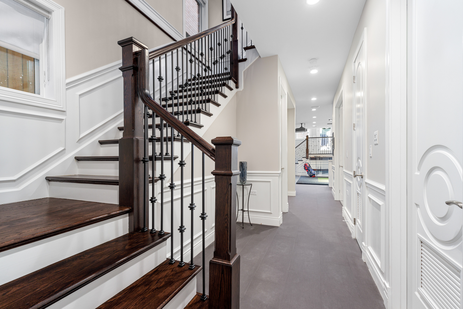 Undisclosed Address Chicago, IL 60657 - Photo 32 of 52 a view of staircase with lots of frames on wall and wooden floor
