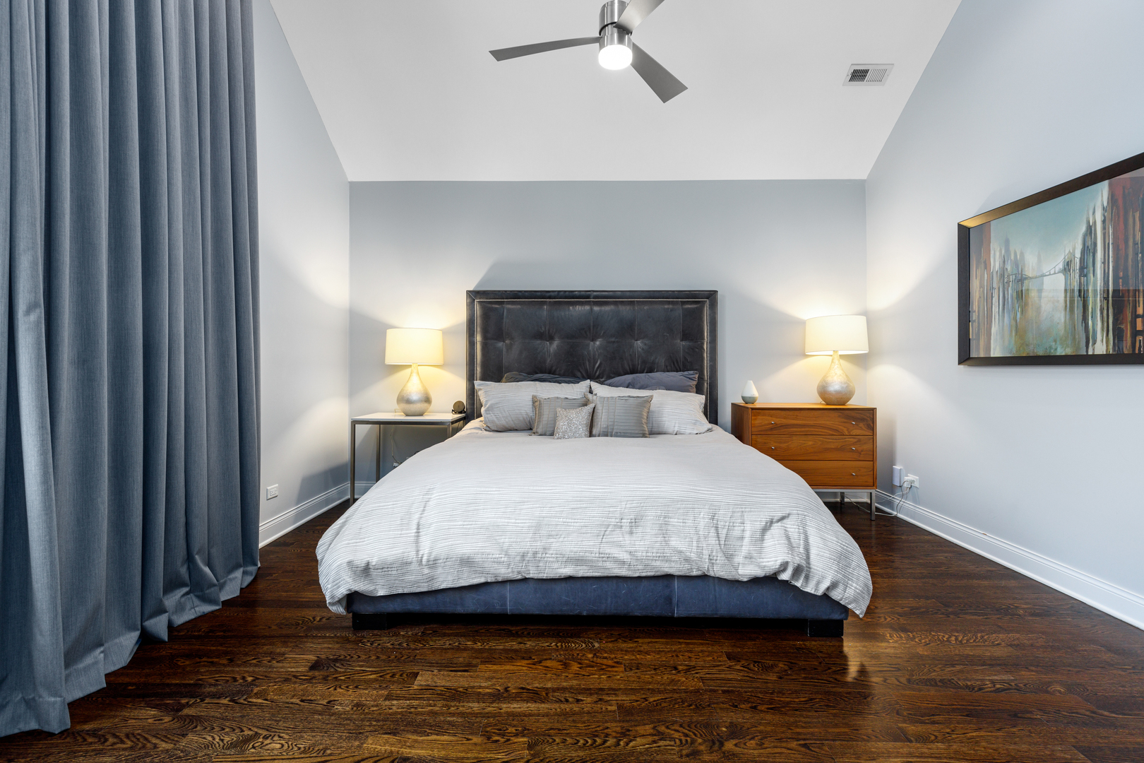 Undisclosed Address Chicago, IL 60657 - Photo 41 of 52 a bedroom with a bed and wooden floor