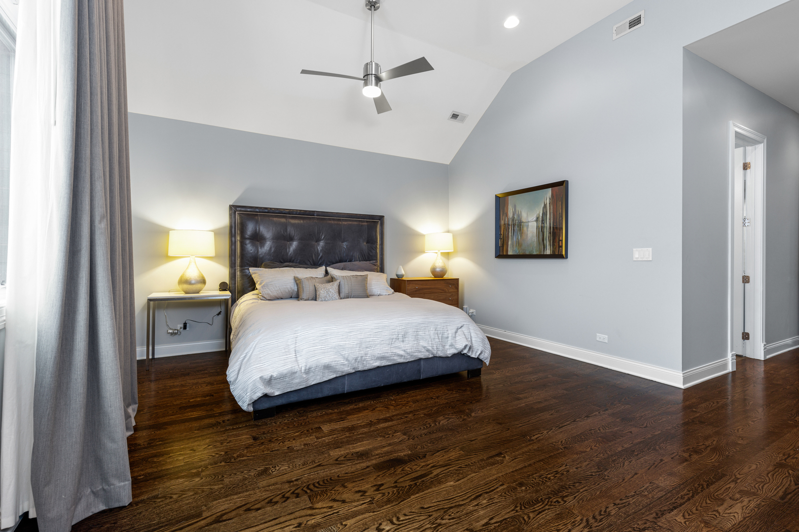 Undisclosed Address Chicago, IL 60657 - Photo 42 of 52 a bedroom with a bed and wooden floor