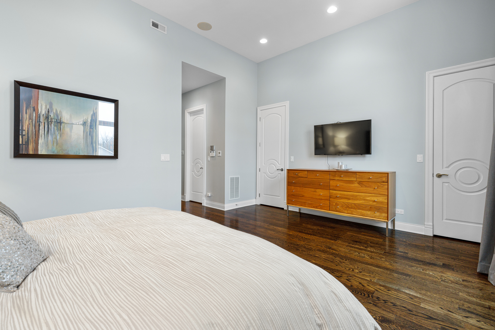 Undisclosed Address Chicago, IL 60657 - Photo 43 of 52 a bedroom with a bed and a flat screen tv