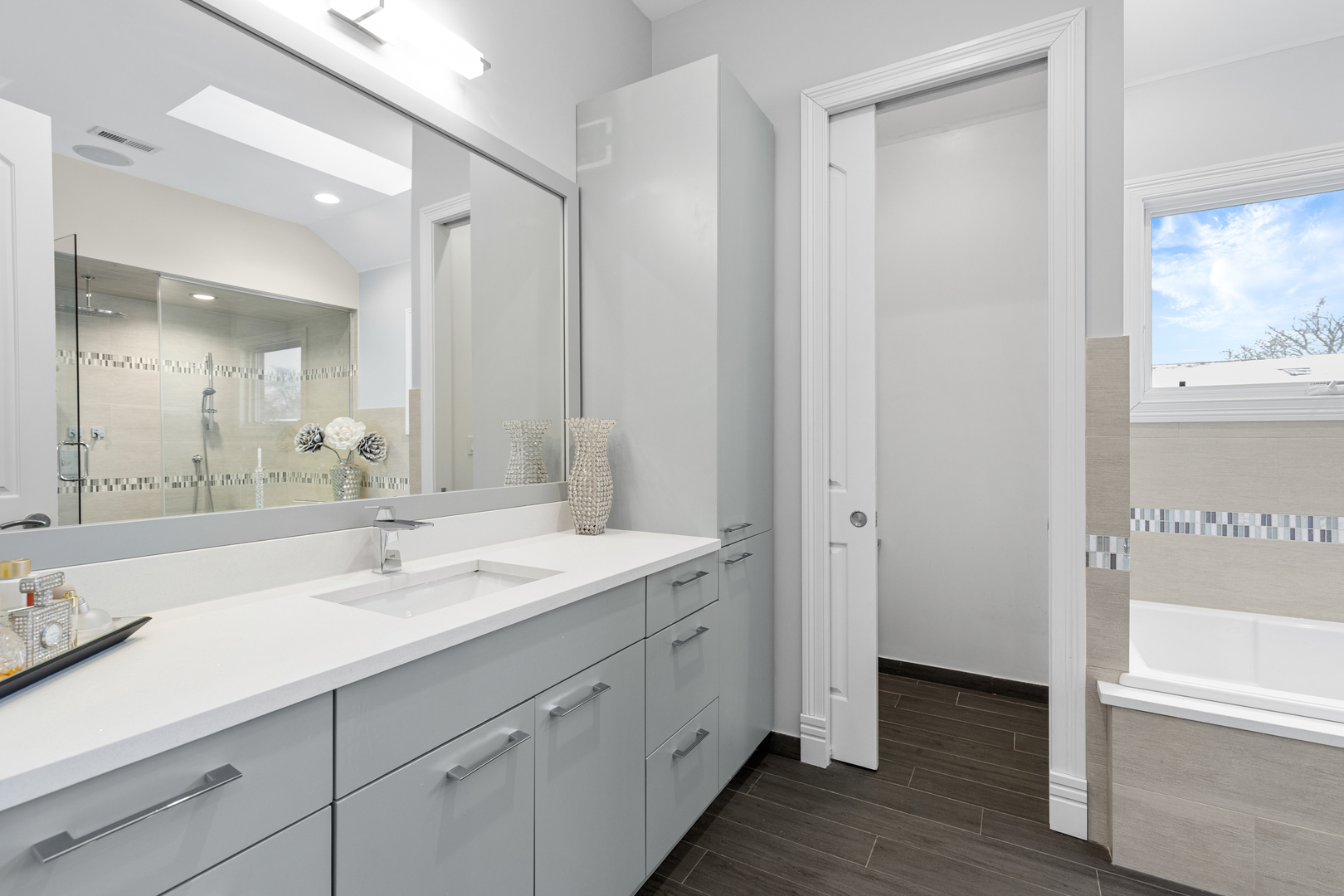 Undisclosed Address Chicago, IL 60657 - Photo 44 of 52 a spacious bathroom with a double vanity sink mirror and