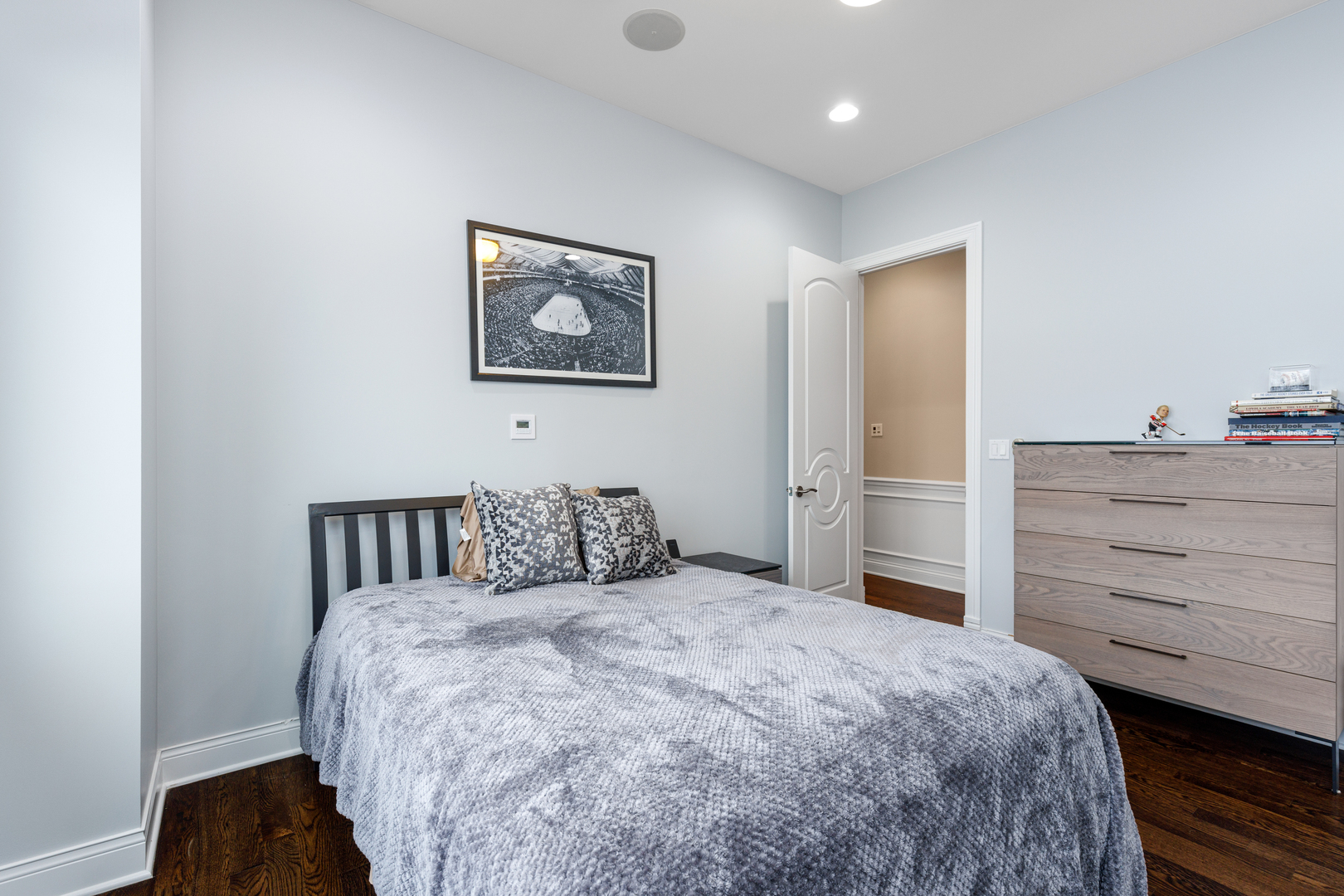 Undisclosed Address Chicago, IL 60657 - Photo 47 of 52 a bedroom with a bed and a dresser