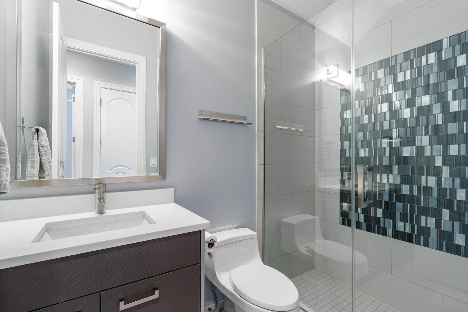 Undisclosed Address Chicago, IL 60657 - Photo 50 of 52 a bathroom with a sink a toilet and shower