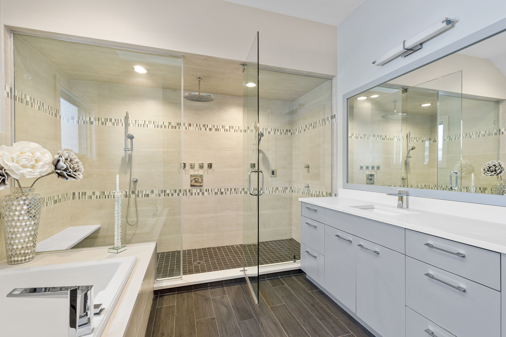 Undisclosed Address Chicago, IL 60657 - Photo 52 of 52 a bathroom with a tub sink mirror and shower