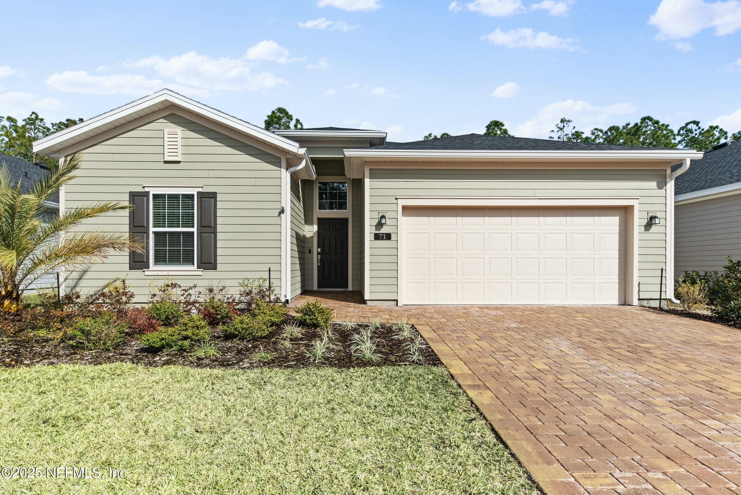 71 Blue Cypress Trail St. Augustine, FL 32084 - Photo 1 of 28 front view of a house with a yard