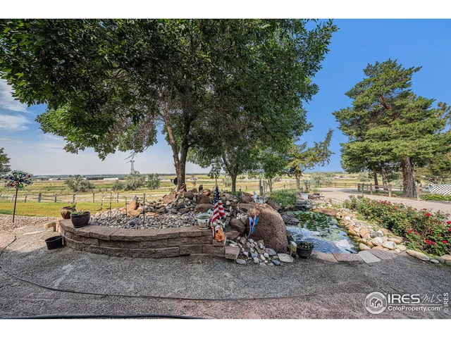 a view of a swimming pool and lounge chairs