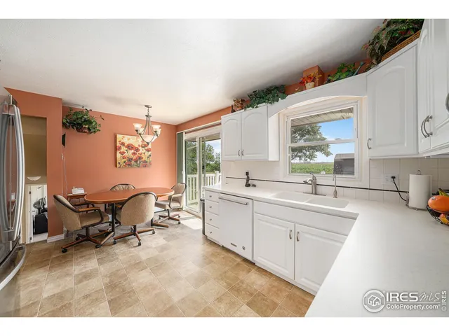 a kitchen with sink and window