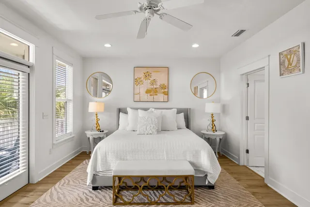 a bed room with a bed mirror and a window