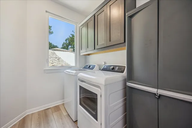 a utility room with washer and dryer