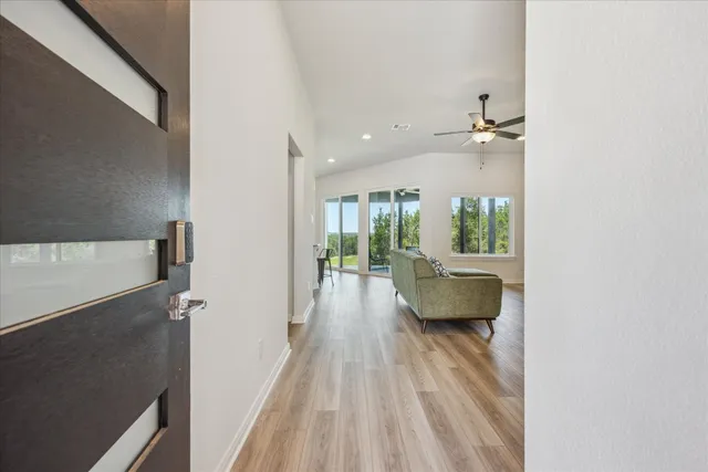 a view of an entryway with wooden floor