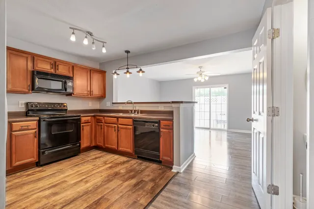 a kitchen with stainless steel appliances granite countertop a stove and a refrigerator