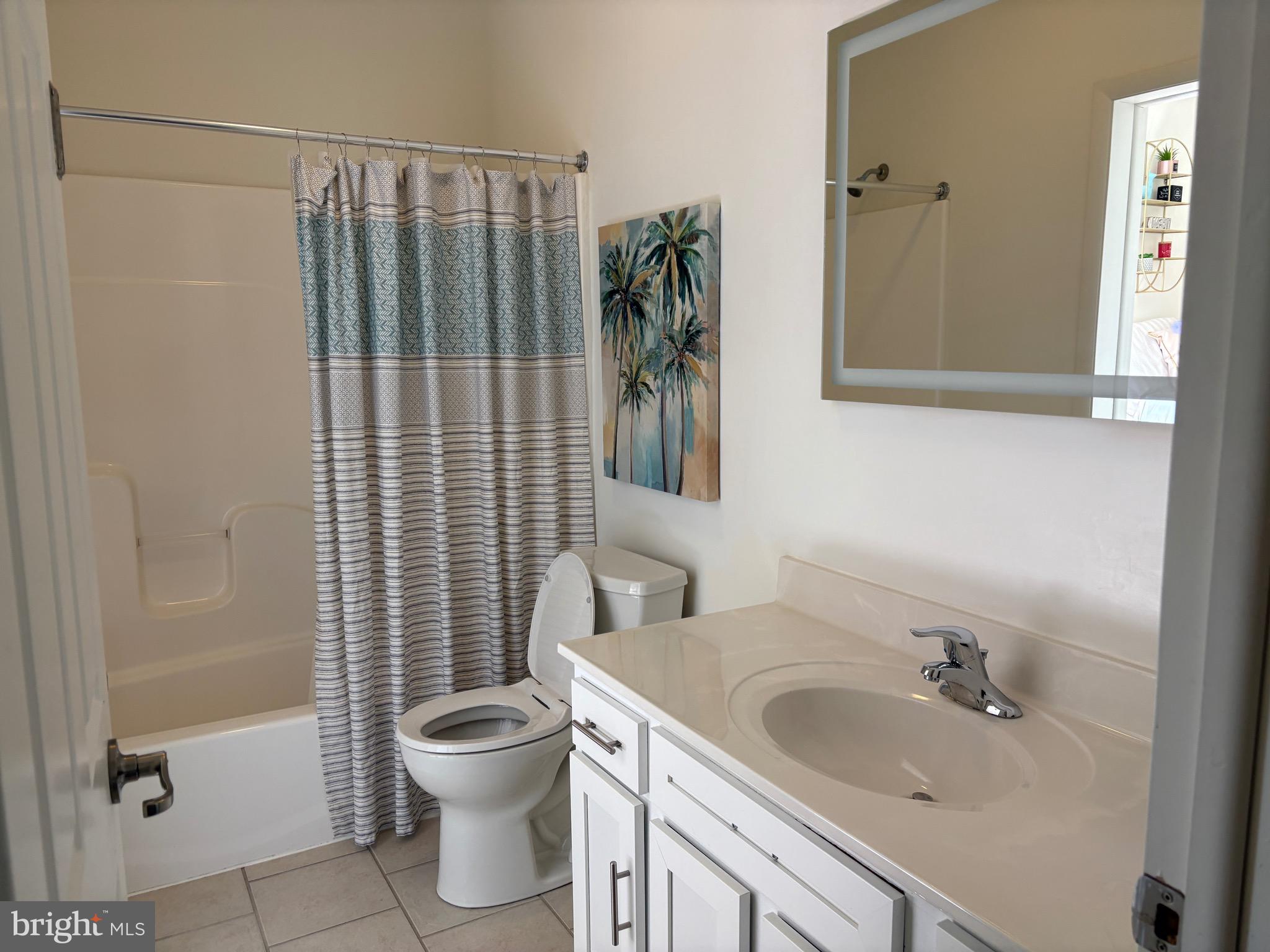 1000 Diamond Street, Unit E Philadelphia, PA 19122 - Photo 12 of 25 a bathroom with a sink toilet and shower