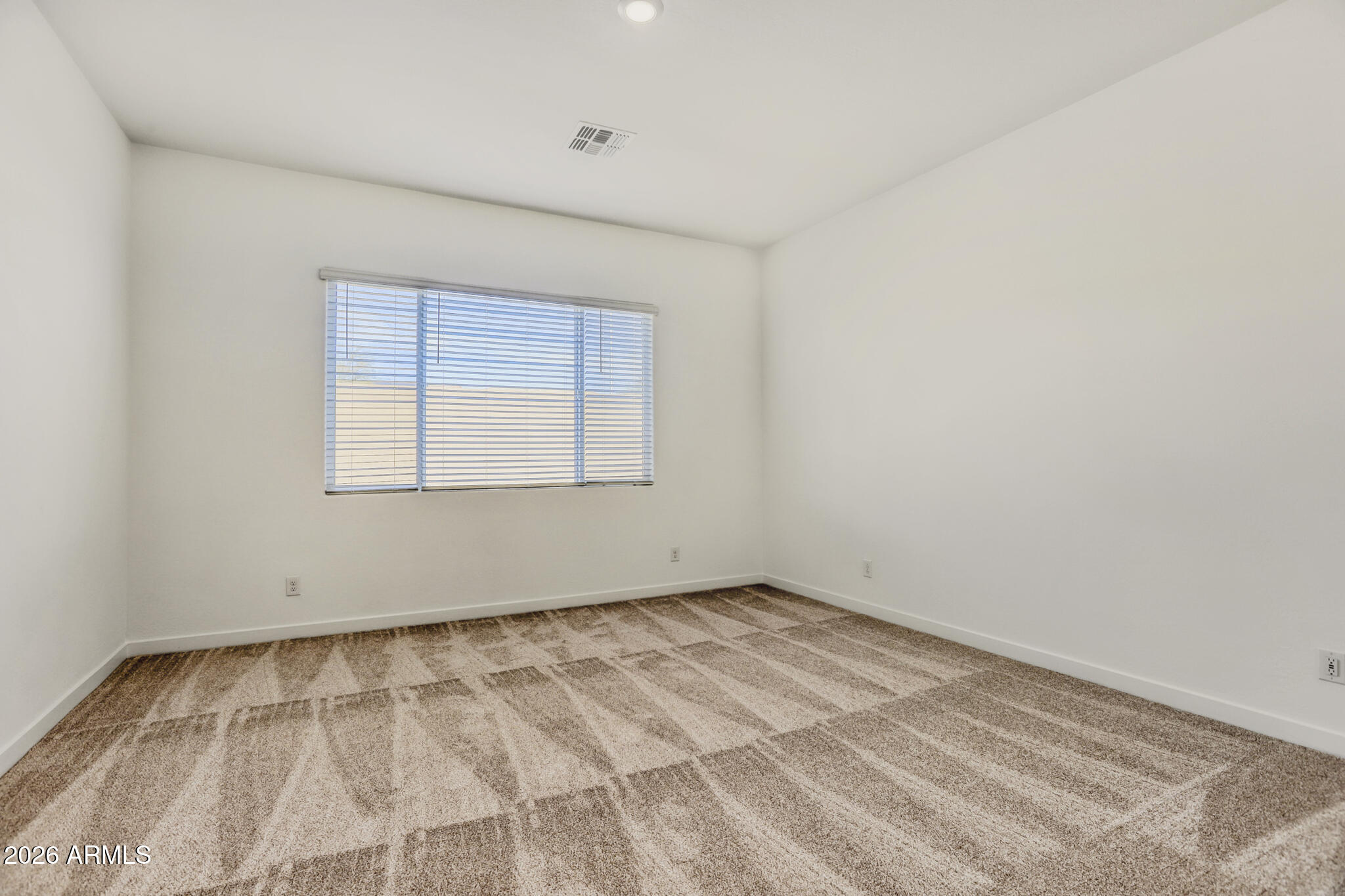 7954 West Rowel Road Peoria, AZ 85383 - Photo 12 of 31 an empty room with a window