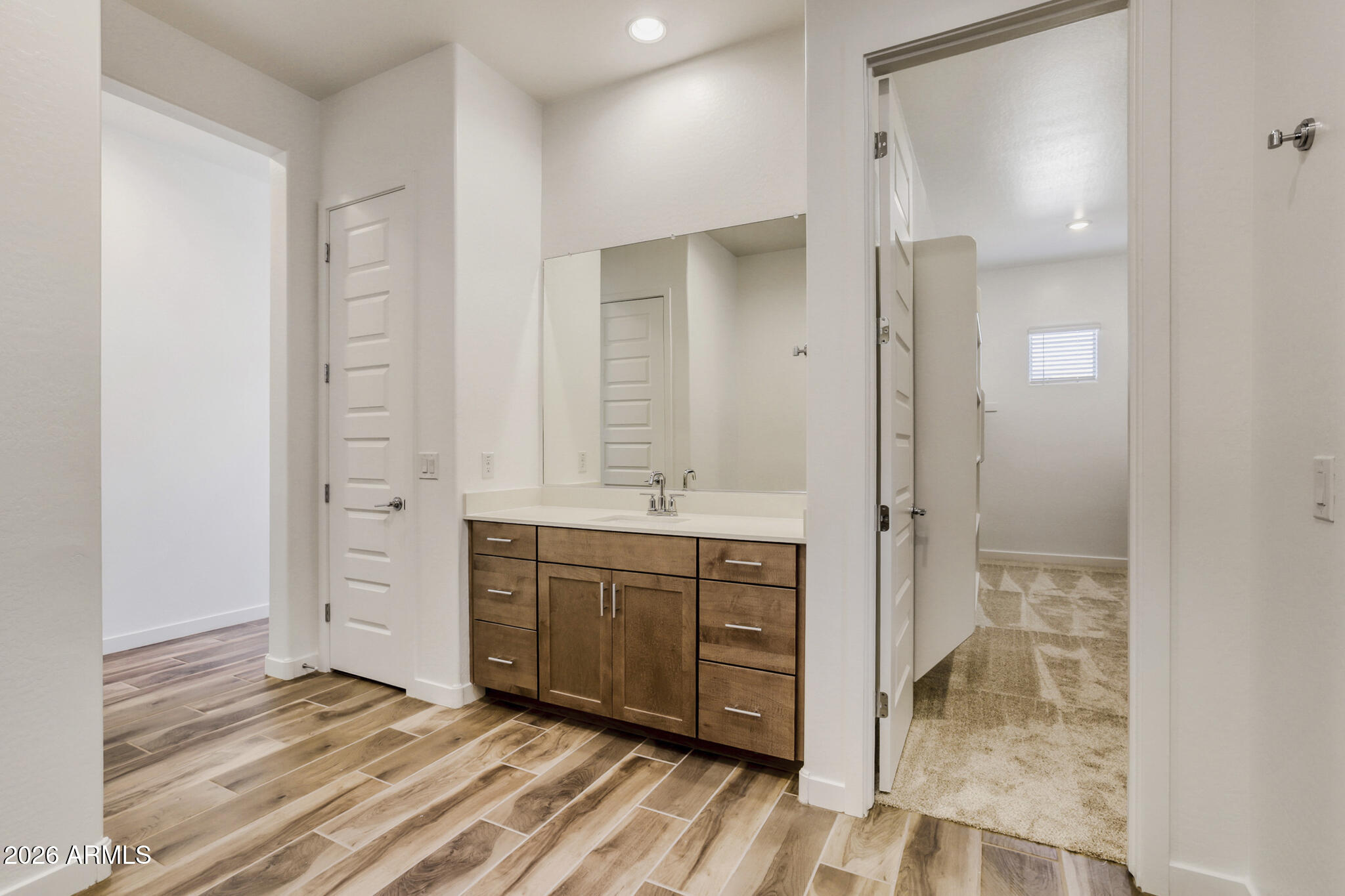 7954 West Rowel Road Peoria, AZ 85383 - Photo 13 of 31 a bathroom with a sink and a mirror