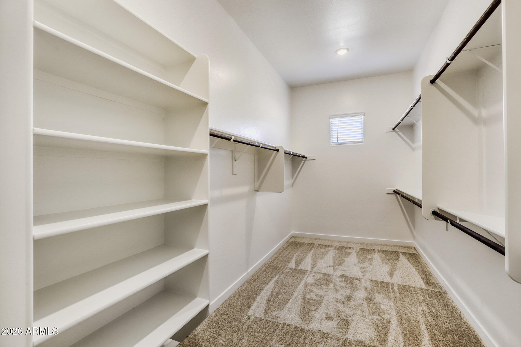 7954 West Rowel Road Peoria, AZ 85383 - Photo 15 of 31 a view of walk in closet with empty racks