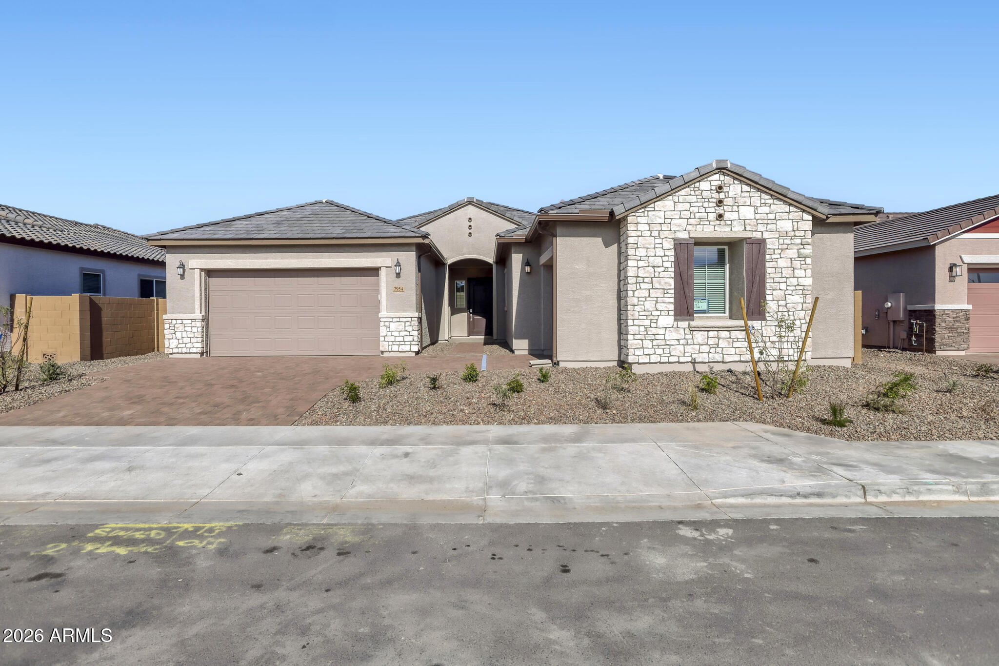 7954 West Rowel Road Peoria, AZ 85383 - Photo 2 of 31 a front view of a house with a yard