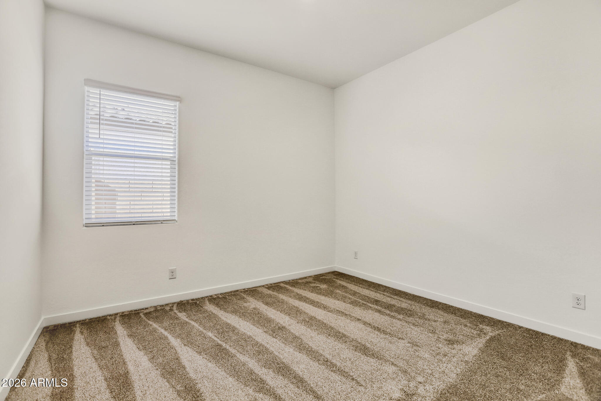 7954 West Rowel Road Peoria, AZ 85383 - Photo 21 of 31 a view of a room that has a window in it