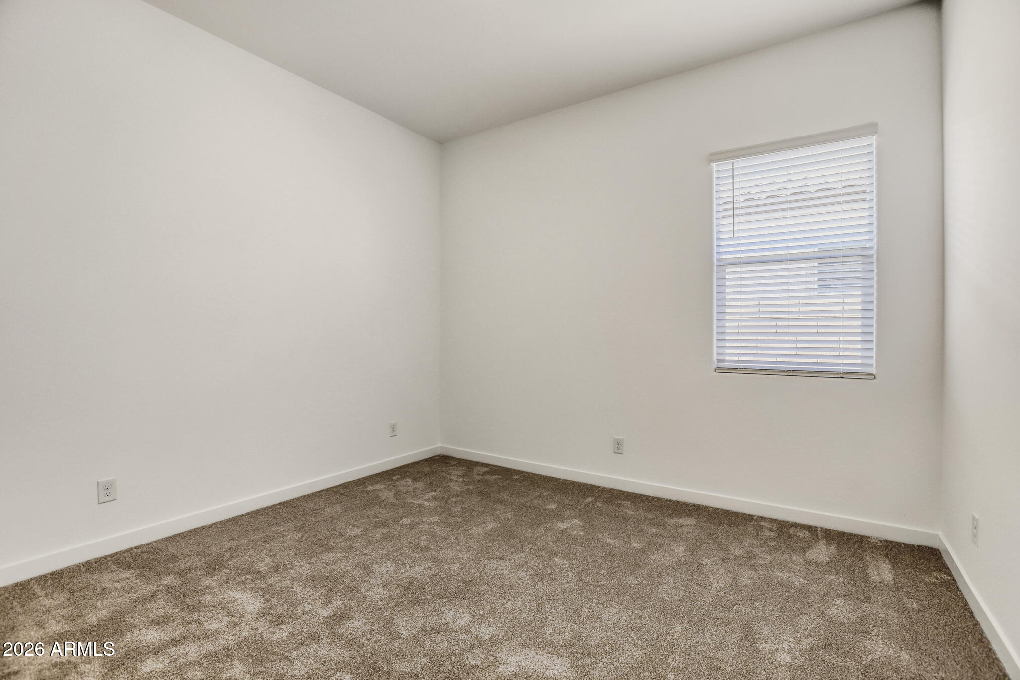 7954 West Rowel Road Peoria, AZ 85383 - Photo 23 of 31 an empty room with a window