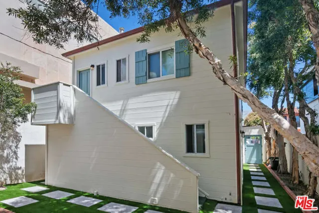 a view of a house with a street