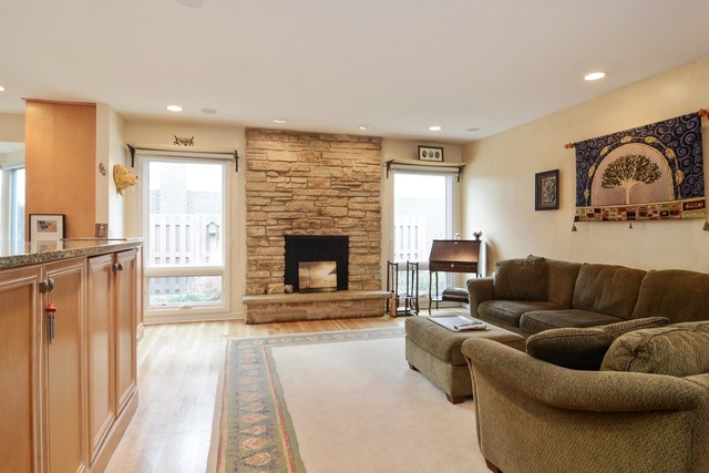 1808 Birch Road Northbrook, IL 60062 - Photo 15 of 24 a living room with furniture and a fireplace