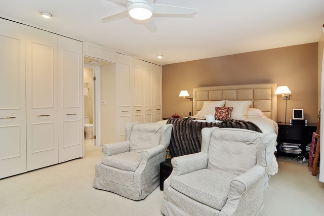 1808 Birch Road Northbrook, IL 60062 - Photo 17 of 24 a living room with furniture and a chandelier