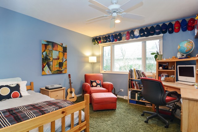 1808 Birch Road Northbrook, IL 60062 - Photo 19 of 24 a bedroom with a bed and a window