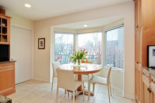 1808 Birch Road Northbrook, IL 60062 - Photo 9 of 24 a dining room with furniture window and outside view