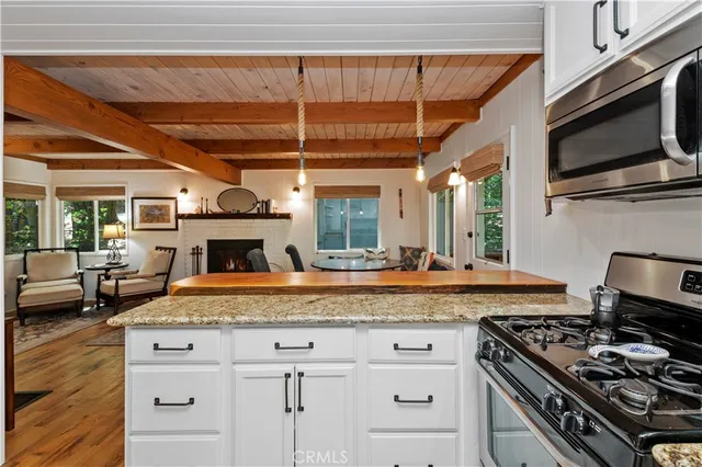 a kitchen with a stove and a microwave