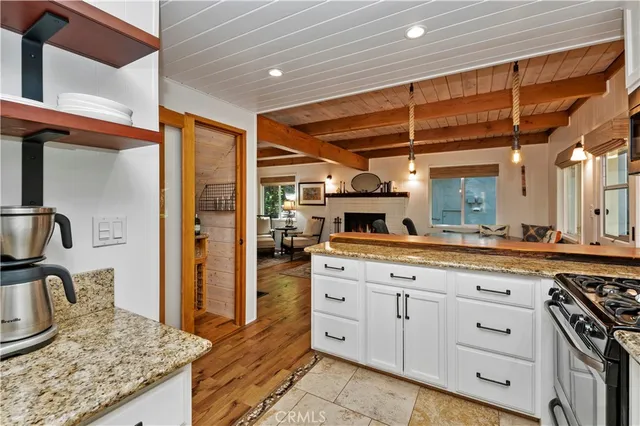 a kitchen with sink stove and cabinets