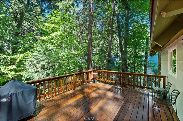 a view of balcony with deck and wooden floor