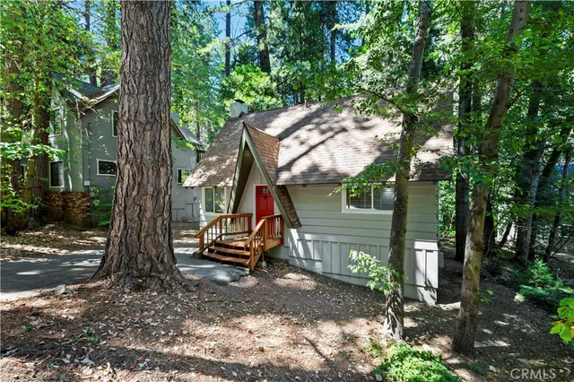 a view of outdoor space with deck and tree