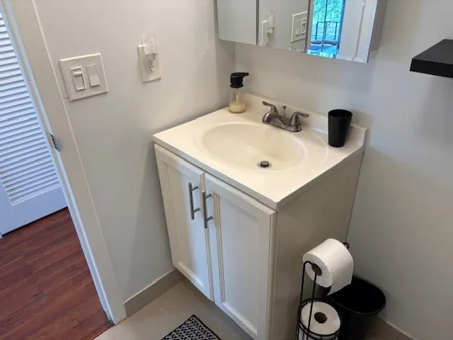 a bathroom with a sink and mirror
